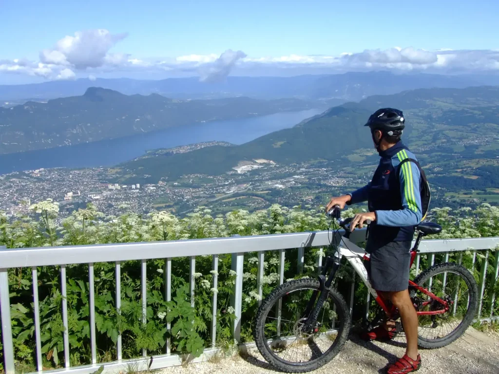 Mountain biker at Le Revard, view of Aix-les-Bains and Lake Bourget